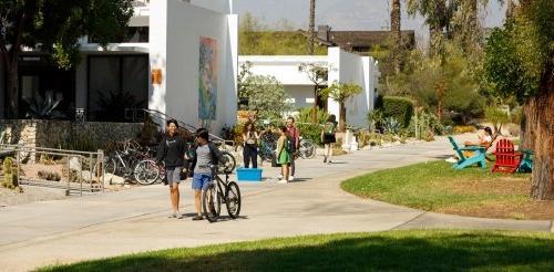 Students walk past the Mounds and Mead Hall.